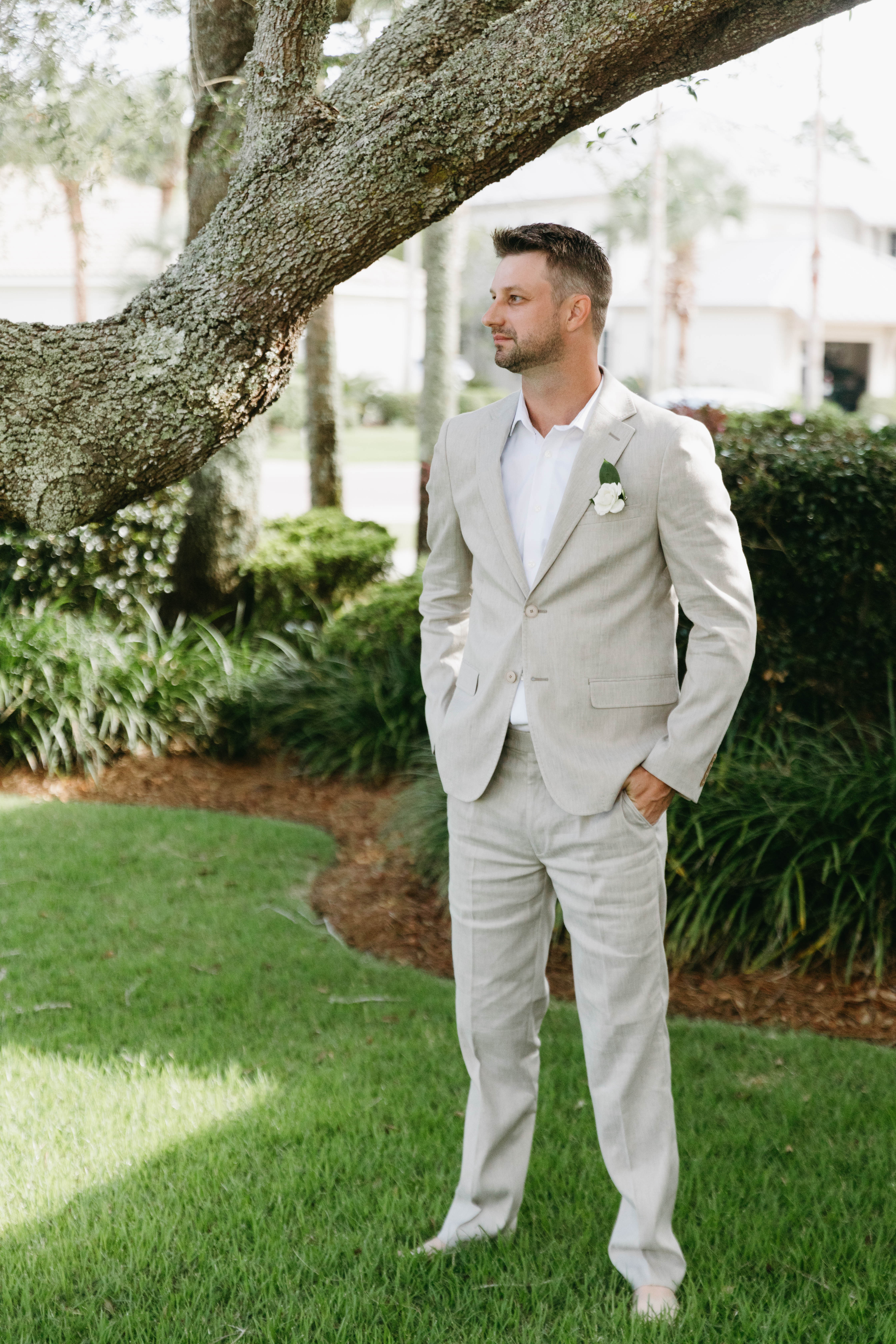 Elegant bride and groom at romantic beach wedding ceremony at sunset